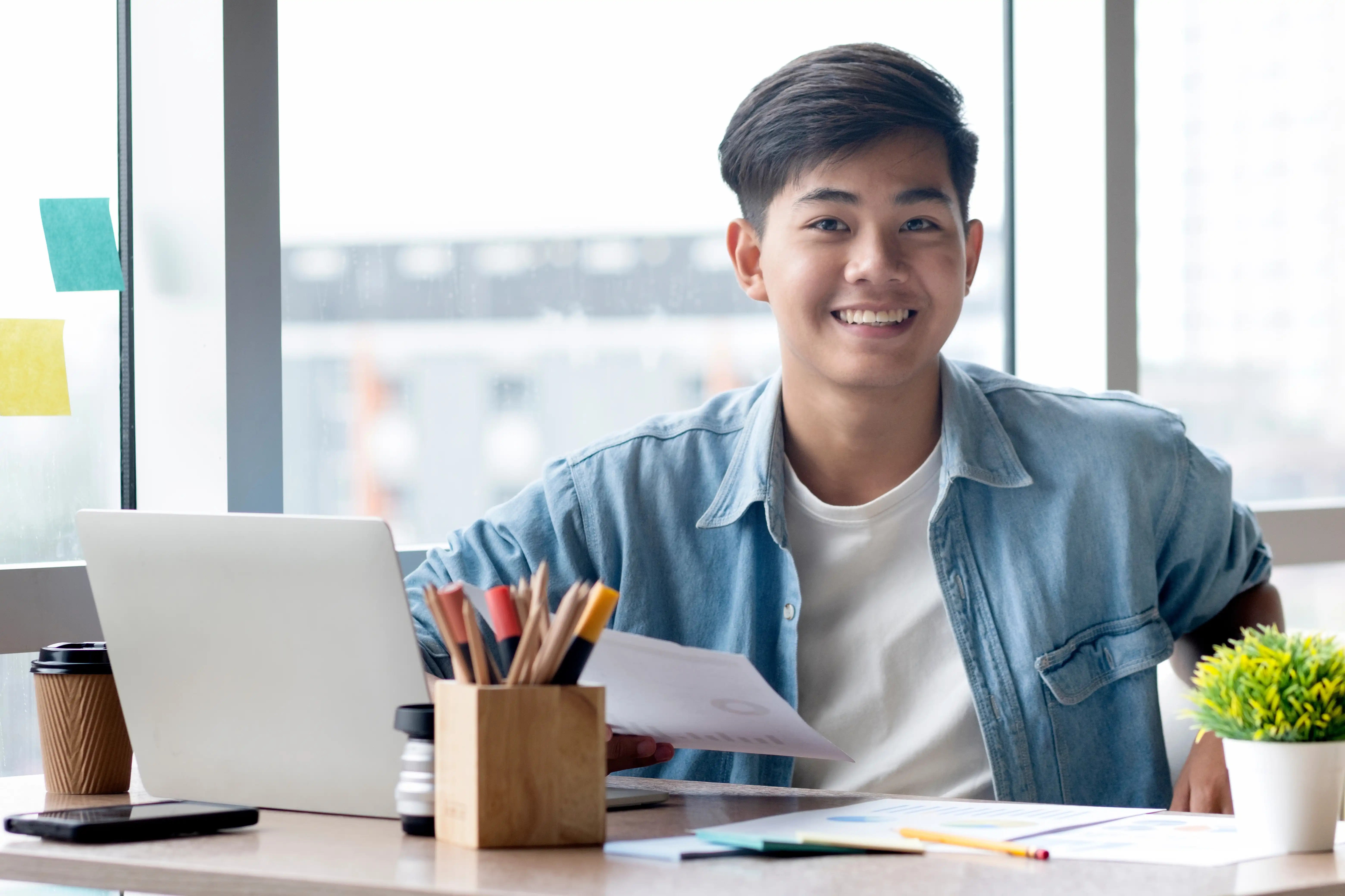 A PKChamps scholar studying at a desk